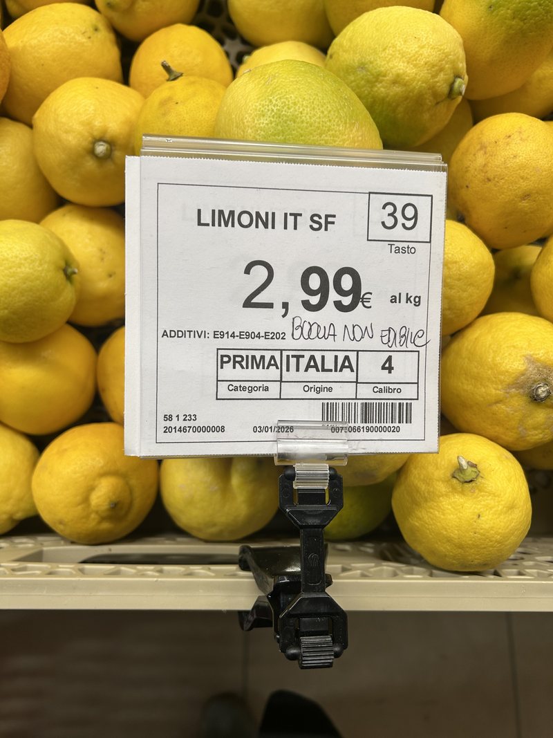 Lemons in a supermarket with an 'Italian' price label