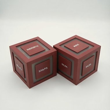 Two red Cubit music cubes